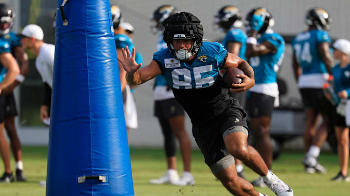 Jacksonville Jaguars tight end Brenton Strange (85) runs through a pop up dummy during an NFL training camp session at the Miller Electric Center, Friday, July 25, 2025, in Jacksonville, Fla. [Corey Perrine/Florida Times-Union]