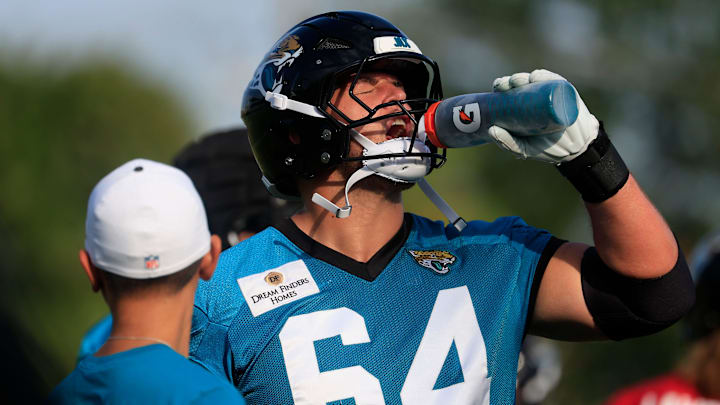 Jacksonville Jaguars guard Wyatt Milum (64) hydrates during an NFL training camp session at the Miller Electric Center, Wednesday, July 23, 2025, in Jacksonville, Fla. [Corey Perrine/Florida Times-Union]
