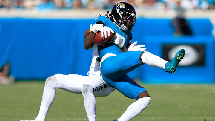 Jacksonville Jaguars wide receiver Brian Thomas Jr. (7) is tackled by Seattle Seahawks safety Nick Emmanwori (3) during the fourth quarter of an NFL football matchup, Sunday, Oct. 12, 2025, at EverBank Stadium in Jacksonville, Fla. Jacksonville Jaguars wide receiver Brian Thomas Jr. (7) is tackled by Seattle Seahawks safety Nick Emmanwori (3) during the fourth quarter of an NFL football matchup, Sunday, Oct. 12, 2025, at EverBank Stadium in Jacksonville, Fla.