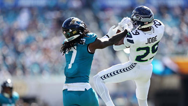 Oct 12, 2025; Jacksonville, Florida, USA; Jacksonville Jaguars wide receiver Brian Thomas Jr. (7) takes the ball from Seattle Seahawks cornerback Josh Jobe (29) during the second half at EverBank Stadium. Oct 12, 2025; Jacksonville, Florida, USA; Jacksonville Jaguars wide receiver Brian Thomas Jr. (7) takes the ball from Seattle Seahawks cornerback Josh Jobe (29) during the second half at EverBank Stadium.