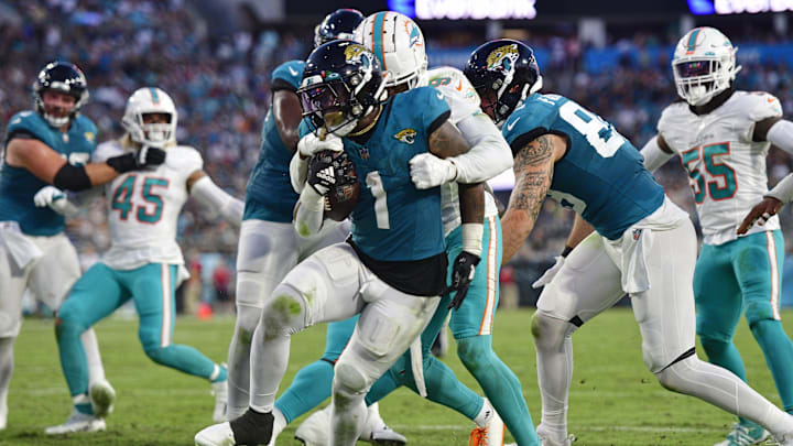Jacksonville Jaguars running back Travis Etienne Jr. (1) scores a touchdown against Miami Dolphins