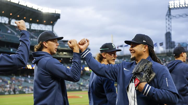 Apr 2, 2024; Seattle, Washington, USA; Seattle Mariners starting pitcher Luis Castillo (58, right) bumps fists with starting pitcher Logan Gilbert (36) before a game against the Cleveland Guardians at T-Mobile Park. Mandatory Credit: Joe Nicholson-Imagn Images
