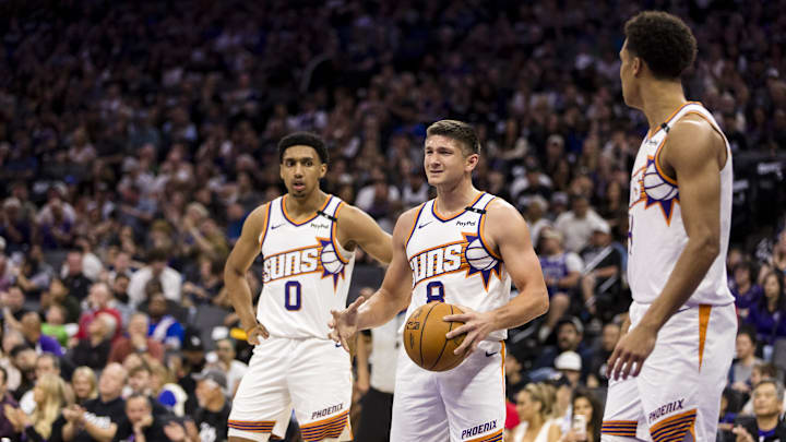 Apr 13, 2025; Sacramento, California, USA;  Phoenix Suns guard Grayson Allen (8) and forward Ryan Dunn (0) react during the second quarter against the Sacramento Kings at Golden 1 Center. Mandatory Credit: John Hefti-Imagn Images
