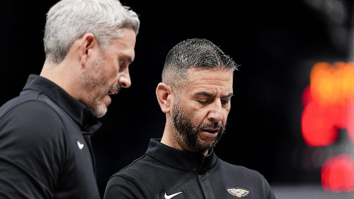 Feb 2, 2026; Charlotte, North Carolina, USA; New Orleans Pelicans head coach James Borrego chats with assistant Casey Hill  during the second quarter against the Charlotte Hornets at the Spectrum Center. Mandatory Credit: Jim Dedmon-Imagn Images