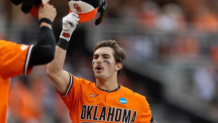 Jun 2, 2024; Stillwater, OK, USA; Oklahoma State utility Zach Ehrhard (4) celebrates at home plate during a NCAA regional baseball game against Florida at O'Brate Stadium. Mandatory Credit: Mitch Alcala-The Oklahoman