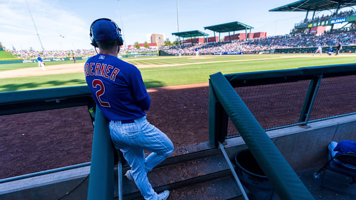 Mar 26, 2023; Mesa, Arizona, USA;  Chicago Cubs infielder Nico Hoerner (2) takes time for an
