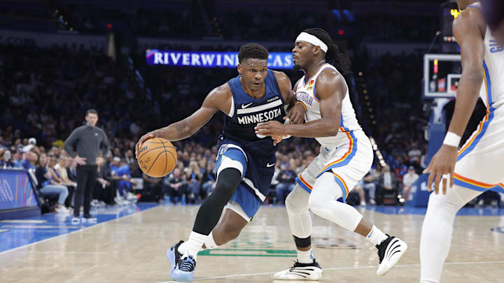 Feb 24, 2025; Oklahoma City, Oklahoma, USA; Minnesota Timberwolves guard Anthony Edwards (5) moves the ball down the court as Oklahoma City Thunder guard Luguentz Dort (5) defends during the second half at Paycom Center. Mandatory Credit: Alonzo Adams-Imagn Images