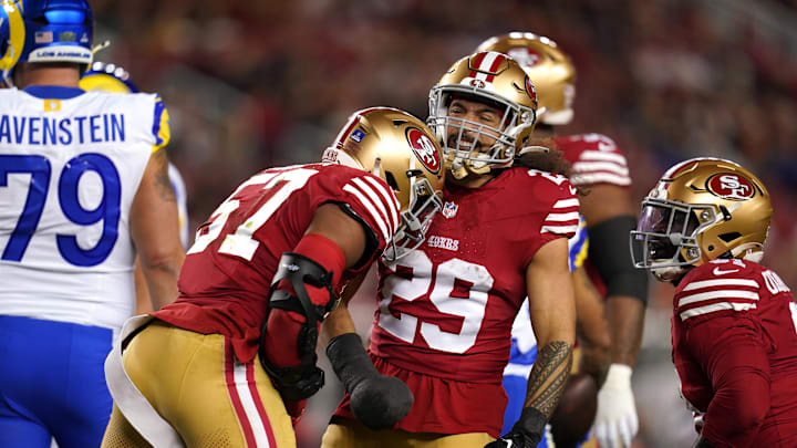Dec 12, 2024; Santa Clara, California, USA; San Francisco 49ers linebacker Dre Greenlaw (57) is congratulated by safety Talanoa Hufanga (29) after making a tackle against the Los Angeles Rams in the first quarter at Levi's Stadium. Mandatory Credit: Cary Edmondson-Imagn Images