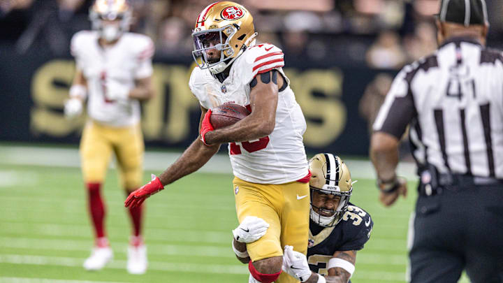 Sep 14, 2025; New Orleans, Louisiana, USA;  San Francisco 49ers wide receiver Jauan Jennings (15) runs after a catch against New Orleans Saints safety Jonas Sanker (33) during the first half at Caesars Superdome. Mandatory Credit: Stephen Lew-Imagn Images