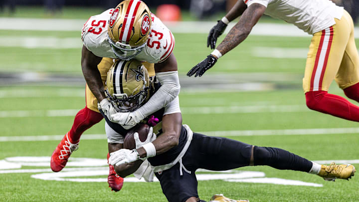 Sep 14, 2025; New Orleans, Louisiana, USA;  New Orleans Saints wide receiver Rashid Shaheed (22) is tackled by San Francisco 49ers linebacker Dee Winters (53) during the second half at Caesars Superdome. Mandatory Credit: Stephen Lew-Imagn Images