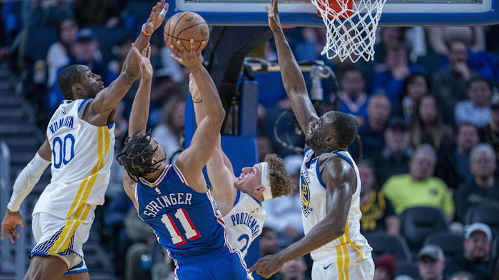 Jan 30, 2024; San Francisco, California, USA;  Philadelphia 76ers guard Jaden Springer (11) shoots against Golden State Warriors forward Jonathan Kuminga (00), guard Brandin Podziemski (2) and forward Draymond Green (23) during the fourth quarter at Chase Center. Mandatory Credit: Neville E. Guard-Imagn Images