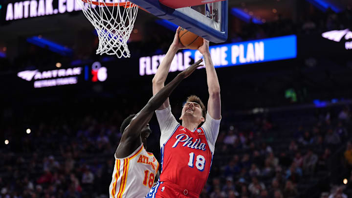 Apr 11, 2025; Philadelphia, Pennsylvania, USA; Philadelphia 76ers center Colin Castleton (18) drives to shoot against Atlanta Hawks forward Mouhamed Gueye (18) in the third quarter at Wells Fargo Center. Mandatory Credit: Kyle Ross-Imagn Images