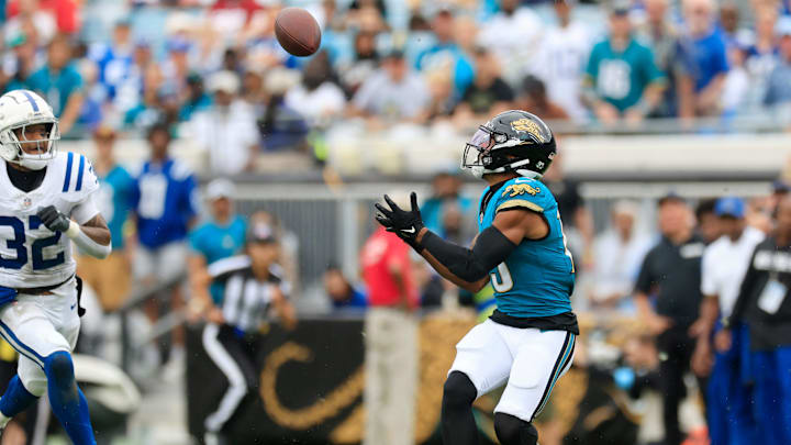 Jacksonville Jaguars wide receiver Christian Kirk (13) hauls in a reception as Indianapolis Colts safety Julian Blackmon (32) looks on during the fourth quarter of an NFL football matchup Sunday, Oct. 6, 2024 at EverBank Stadium in Jacksonville, Fla. The Jaguars edged the Colts on a field goal 37-34. [Corey Perrine/Florida Times-Union]
