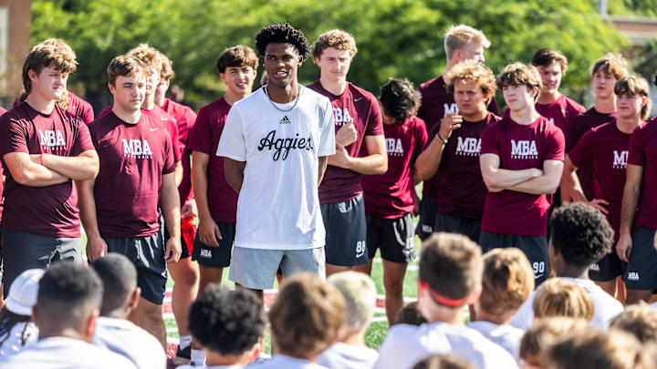 Former MBA quarterback and current Texas A&M starter Marcel Reed speaks at the start of a kids’ football camp held at MBA 