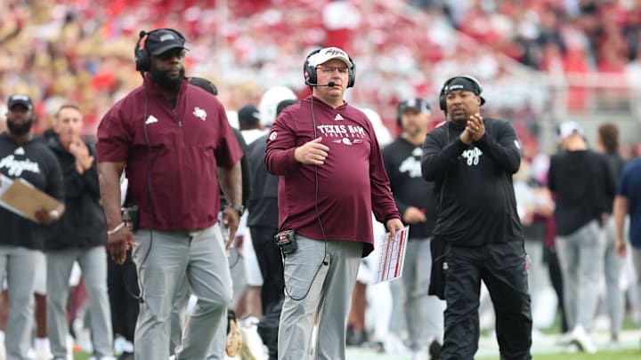Texas A&M Aggies head coach Mike Elko during the first quarter against the Arkansas Razorbacks at Donald W. Reynolds Razorback Stadium. 