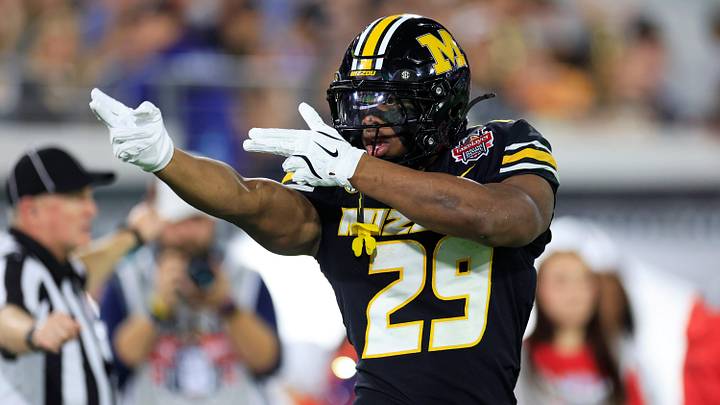 Missouri Tigers running back Ahmad Hardy (29) reacts to his first down pickup during the first quarter of the TaxSlayer Gator Bowl. Missouri Tigers running back Ahmad Hardy (29) reacts to his first down pickup during the first quarter of the TaxSlayer Gator Bowl.