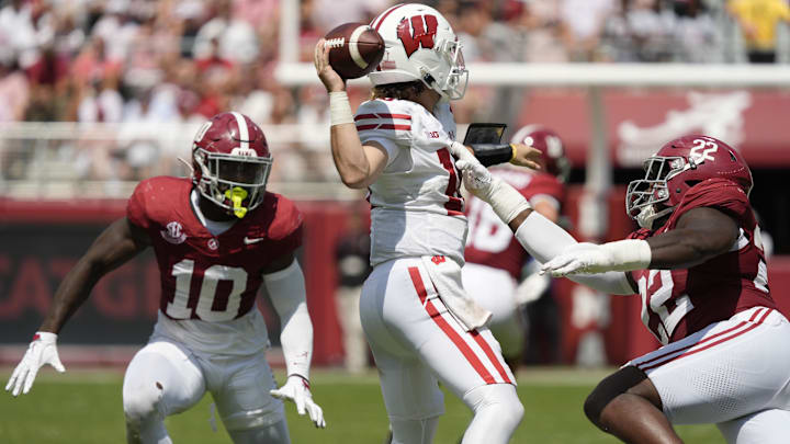 Sep 13, 2025; Tuscaloosa, Alabama, USA;  Alabama linebacker Justin Jefferson (10) and Alabama defensive lineman LT Overton (22) pressure Wisconsin quarterback Danny O'Neil (18) as he passes the ball at Saban Field at Bryant-Denny Stadium. Mandatory Credit: Gary Cosby-USA TODAY Network via Imagn Images