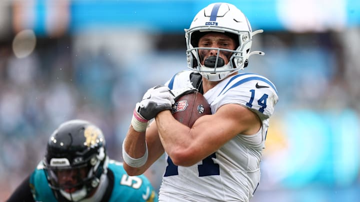 Oct 6, 2024; Jacksonville, Florida, USA; Indianapolis Colts wide receiver Alec Pierce (14) scores a touchdown against the Jacksonville Jaguars in the fourth quarter at EverBank Stadium. Mandatory Credit: Nathan Ray Seebeck-Imagn Images