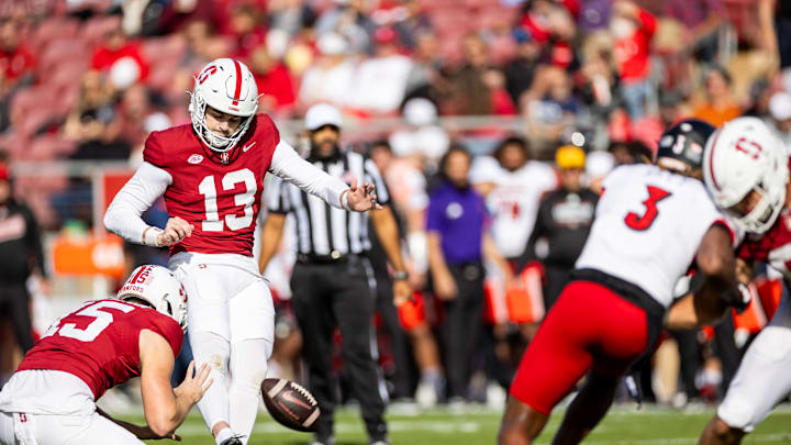 Nov 16, 2024; Stanford, California, USA; Stanford Cardinal place kicker Emmet Kenney (13) kicks a field goal during the first quarter against the Louisville Cardinals at Stanford Stadium. Mandatory Credit: Bob Kupbens-Imagn Images
