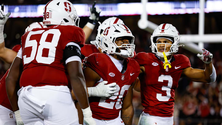 Nov 22, 2025; Stanford, California, USA; Stanford Cardinal running back Micah Ford (20) celebrates with teammates after scoring a touchdown during the fourth quarter against the California Golden Bears at Stanford Stadium. Mandatory Credit: Sergio Estrada-Imagn Images Nov 22, 2025; Stanford, California, USA; Stanford Cardinal running back Micah Ford (20) celebrates with teammates after scoring a touchdown during the fourth quarter against the California Golden Bears at Stanford Stadium. Mandatory Credit: Sergio Estrada-Imagn Images