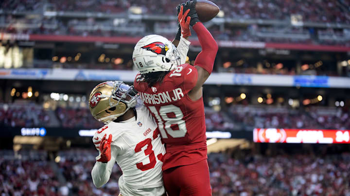 Jan 5, 2025; Glendale, Arizona, USA; San Francisco 49ers cornerback Rock Ya-Sin (33) breaks up a pass intended for Arizona Cardinals wide receiver Marvin Harrison Jr. (18) in the second half at State Farm Stadium. Mandatory Credit: Mark J. Rebilas-Imagn Images