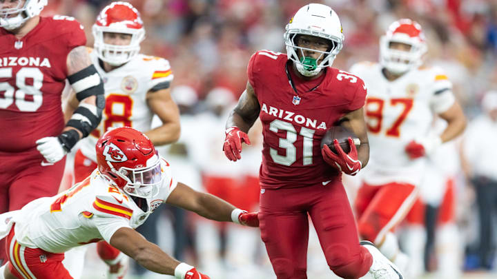 Aug 9, 2025; Glendale, Arizona, USA; Arizona Cardinals running back Emari Demercado (31) runs for a touchdown against the Kansas City Chiefs during a preseason NFL game at State Farm Stadium. Mandatory Credit: Mark J. Rebilas-Imagn Images