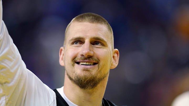  Chuck’s Global Stars center Nikola Jokic (15) of the Denver Nuggets waves to the crowd during the NBA All Star-Practice at Oracle Arena. Mandatory Credit: Cary Edmondson-Imagn Images