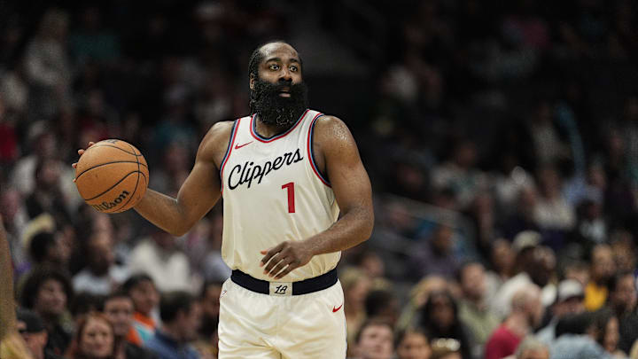 Jan 31, 2025; Charlotte, North Carolina, USA; LA Clippers guard James Harden (1) handles the ball against the Charlotte Hornets during the second half at Spectrum Center. Mandatory Credit: Jim Dedmon-Imagn Images