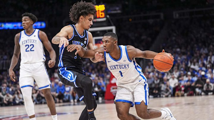 Nov 12, 2024; Atlanta, Georgia, USA; Kentucky Wildcats guard Lamont Butler (1) dribbles against Duke Blue Devils guard Tyrese Proctor (5) during the second half at State Farm Arena. Mandatory Credit: Dale Zanine-Imagn Images