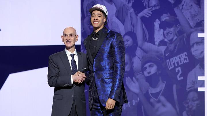 Yanic Konan Niederhauser stands with NBA commissioner Adam Silver after being selected as the 30th pick by the Los Angeles Clippers.