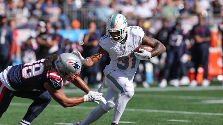 Miami Dolphins running back Raheem Mostert (31) runs the ball during the first half against the New England Patriots at Gillette Stadium. Miami Dolphins running back Raheem Mostert (31) runs the ball during the first half against the New England Patriots at Gillette Stadium.