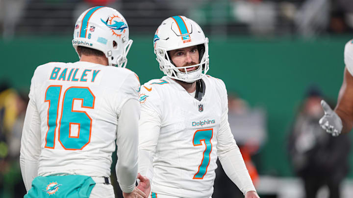 Miami Dolphins place kicker Jason Sanders (7) celebrates a field goal with punter Jake Bailey (16) during the first half against the New York Jets at MetLife Stadium. Miami Dolphins place kicker Jason Sanders (7) celebrates a field goal with punter Jake Bailey (16) during the first half against the New York Jets at MetLife Stadium.
