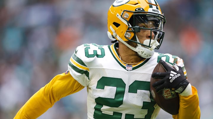 Green Bay Packers cornerback Jaire Alexander (23) runs with the football after intercepting a pass during the fourth quarter against the Miami Dolphins at Hard Rock Stadium.