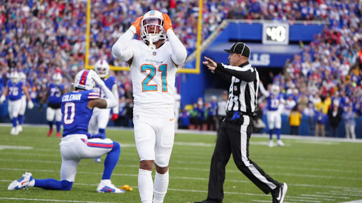Miami Dolphins safety Jordan Poyer (21) reacts to getting penalized on a a hit against Buffalo Bills wide receiver Keon Coleman (0) during the second half at Highmark Stadium.