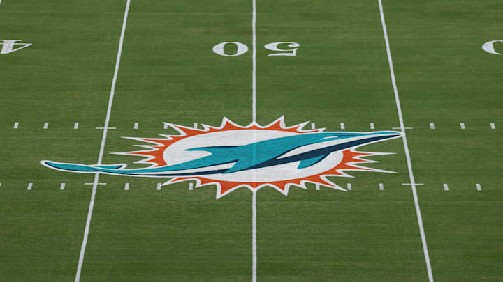 The Miami Dolphins logo is seen at midfield prior to a game against the Baltimore Ravens at Hard Rock Stadium.