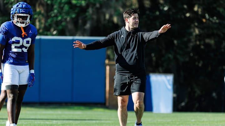 Florida Gators co-defensive coordinator Vinnie Sunseri gestures while Florida Gators inside linebacker Jaden Robinson (29) watches during spring football practice at Heavener Football Complex at the University of Florida in Gainesville, FL on Tuesday, March 11, 2025. [Matt Pendleton/Gainesville Sun]