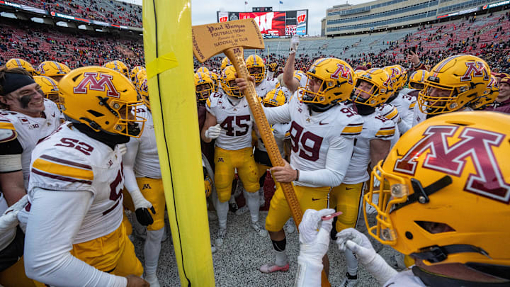Minnesota players pretend to cutdown the goal post with the Paul Bunyan Football Trophy after their game at Camp Randall Stadium Friday, November 29, 2024 in Madison, Wisconsin. Minnesota beat Wisconsin 24-7. Minnesota players pretend to cutdown the goal post with the Paul Bunyan Football Trophy after their game at Camp Randall Stadium Friday, November 29, 2024 in Madison, Wisconsin. Minnesota beat Wisconsin 24-7.