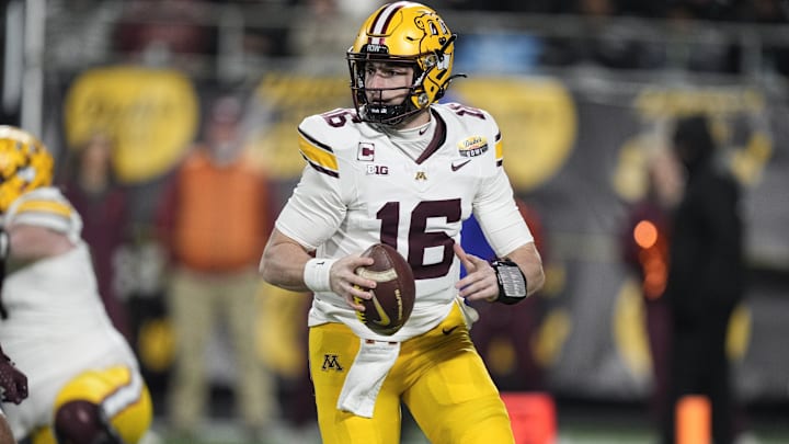 Jan 3, 2025; Charlotte, NC, USA;  Minnesota Golden Gophers quarterback Max Brosmer (16)  looks for a receiver during the first quarter against the Virginia Tech Hokies at the Dukes’ Mayo Bowl at Bank of America Stadium. Mandatory Credit: Jim Dedmon-Imagn Images