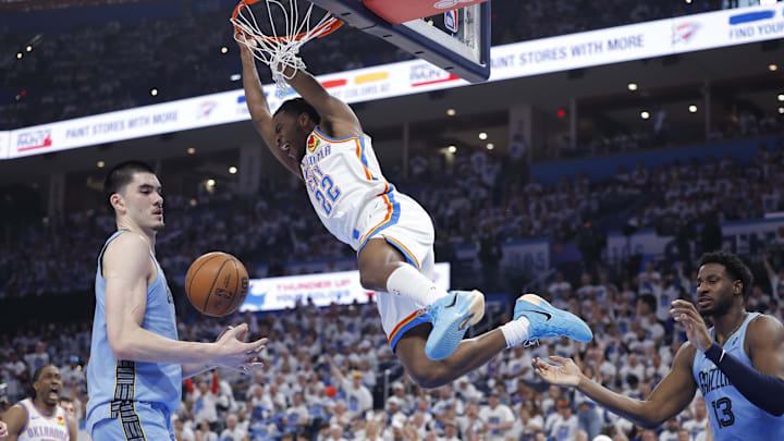 Apr 20, 2025; Oklahoma City, Oklahoma, USA; Oklahoma City Thunder guard Cason Wallace (22) dunks against the Memphis Grizzlies during the second quarter at Paycom Center. Mandatory Credit: Alonzo Adams-Imagn Images