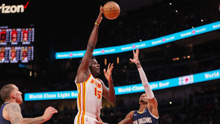 Dec 2, 2024; Atlanta, Georgia, USA; Atlanta Hawks center Clint Capela (15) shoots over New Orleans Pelicans guard Dejounte Murray (5) in the second quarter at State Farm Arena. Mandatory Credit: Brett Davis-Imagn Images