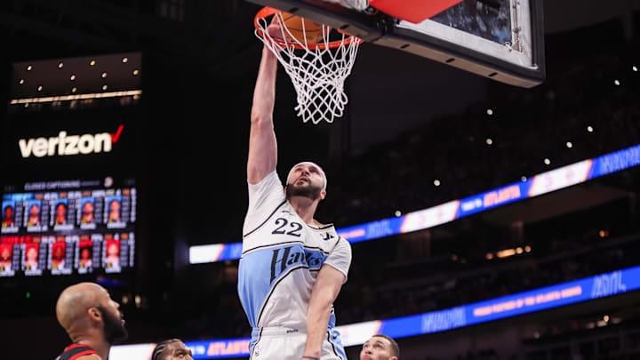 Dec 26, 2024; Atlanta, Georgia, USA; Atlanta Hawks forward Larry Nance Jr. (22) dunks against the Chicago Bulls in the second quarter at State Farm Arena. Mandatory Credit: Brett Davis-Imagn Images