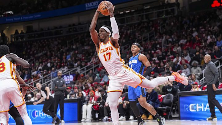 Feb 20, 2025; Atlanta, Georgia, USA; Atlanta Hawks forward Onyeka Okongwu (17) takes down a rebound against the Orlando Magic during the first half at State Farm Arena. Mandatory Credit: Dale Zanine-Imagn Images
