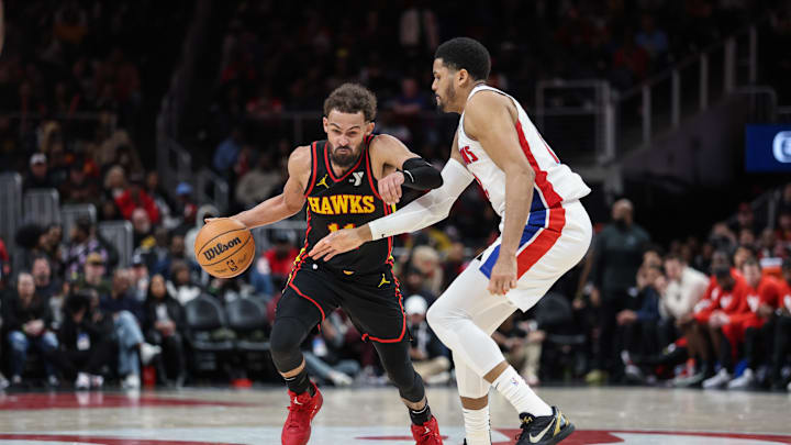 Feb 23, 2025; Atlanta, Georgia, USA; Atlanta Hawks guard Trae Young (11) drives the ball to the basket against Detroit Pistons forward Tobias Harris (12) during the fourth quarter at State Farm Arena. Mandatory Credit: Jordan Godfree-Imagn Images