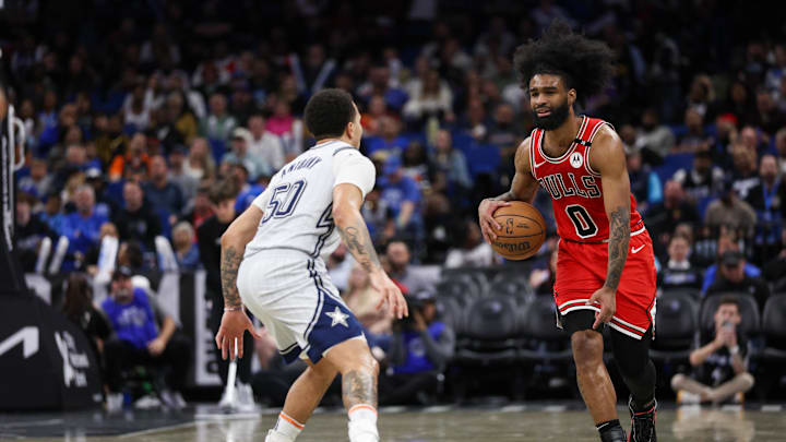 Mar 6, 2025; Orlando, Florida, USA; Chicago Bulls guard Coby White (0) is guarded by Orlando Magic guard Cole Anthony (50) in the third quarter at Kia Center. Mandatory Credit: Nathan Ray Seebeck-Imagn Images