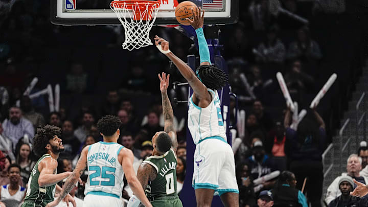Feb 5, 2025; Charlotte, North Carolina, USA; Charlotte Hornets center Mark Williams (5) tries for the block on Milwaukee Bucks guard Damian Lillard (0) during the second half at Spectrum Center. Mandatory Credit: Jim Dedmon-Imagn Images