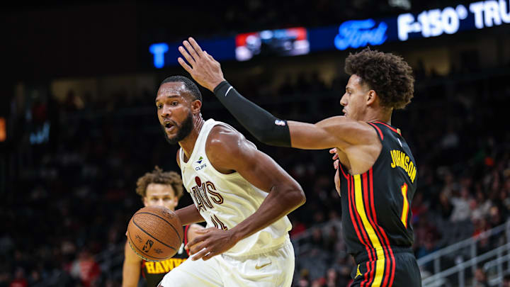 Nov 29, 2024; Atlanta, Georgia, USA; Atlanta Hawks forward Jalen Johnson (1) plays defense against Cleveland Cavaliers forward Evan Mobley (4) during the third quarter at State Farm Arena. Mandatory Credit: Jordan Godfree-Imagn Images