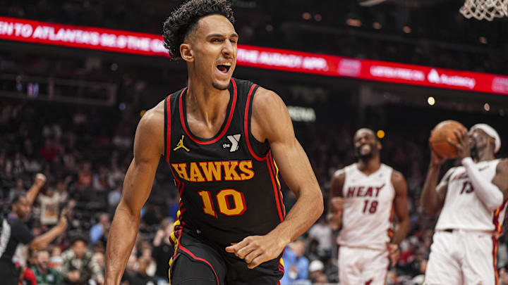 Apr 18, 2025; Atlanta, Georgia, USA; Atlanta Hawks forward Zaccharie Risacher (10) reacts after scoring a basket against the Miami Heat during the first half at State Farm Arena. Mandatory Credit: Dale Zanine-Imagn Images