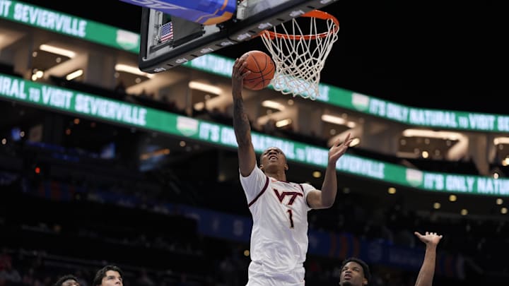 Mar 11, 2025; Charlotte, NC, USA; Virginia Tech Hokies forward Tobi Lawal (1) goes to the basket defended but California Golden Bears forward Lee Dort (34) during the second half at Spectrum Center. Mandatory Credit: Jim Dedmon-Imagn Images Mar 11, 2025; Charlotte, NC, USA; Virginia Tech Hokies forward Tobi Lawal (1) goes to the basket defended but California Golden Bears forward Lee Dort (34) during the second half at Spectrum Center. Mandatory Credit: Jim Dedmon-Imagn Images