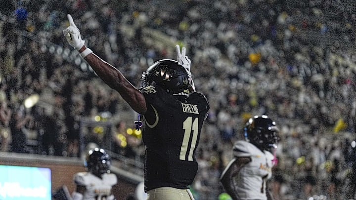 Aug 29, 2024; Winston-Salem, North Carolina, USA;  Wake Forest Demon Deacons wide receiver Donavon Greene (11) celebrates a score against the North Carolina A&T Aggies during the second half at Allegacy Federal Credit Union Stadium. Mandatory Credit: Jim Dedmon-Imagn Images