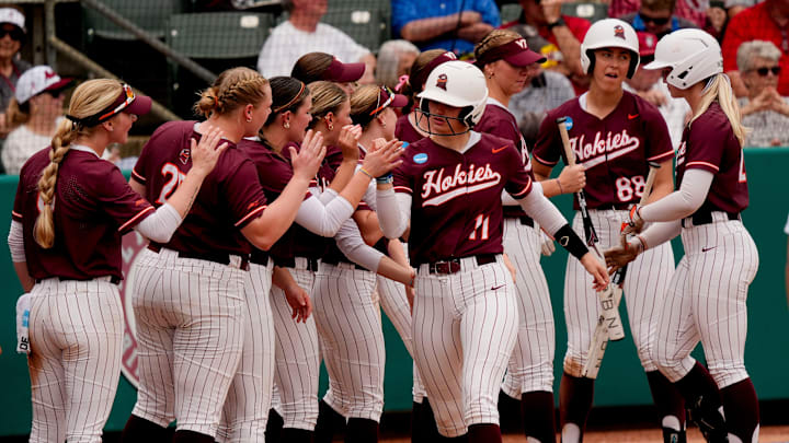 May 17, 2025; Tuscaloosa, AL, USA; Virginia Tech batter Kylie Aldridge is congratulated after hitting a home run at Rhoads Stadium. Alabama defeated Virginia Tech 4-3 to advance to the final.